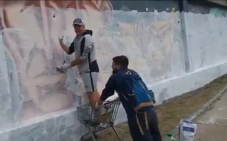 PIT-CNT cubriendo mural